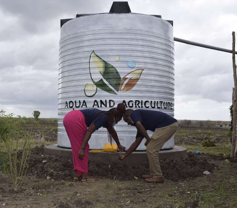 Community members accessing clean water through Aqua A.I project